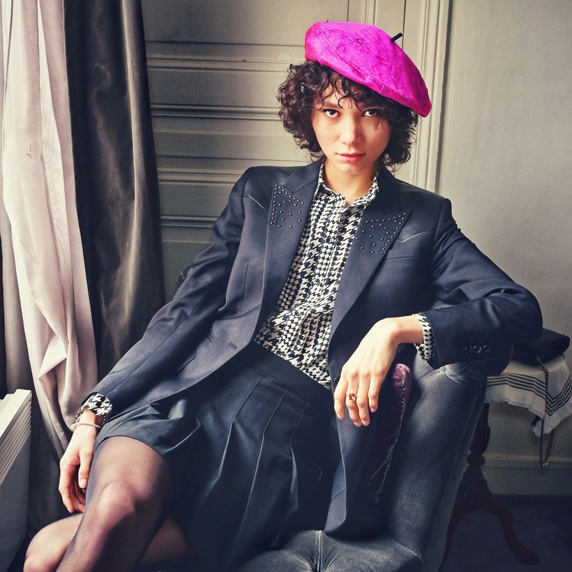 Tailoring editorial — model in oversized navy suiting and a magenta beret