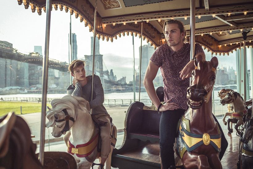 Menswear on Jane's Carousel with the Brooklyn Bridge and Manhattan skyline behind